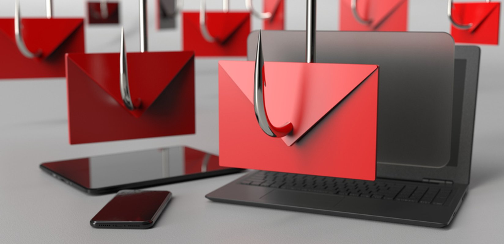 Phishing emails displayed on a laptop and smartphone