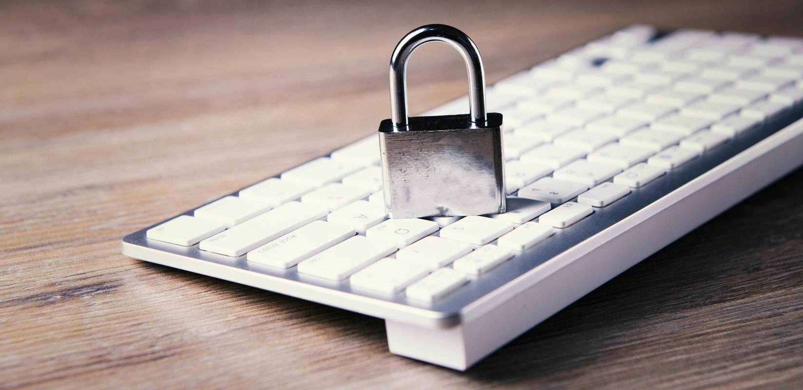 Cybersecurity protection icons over a laptop