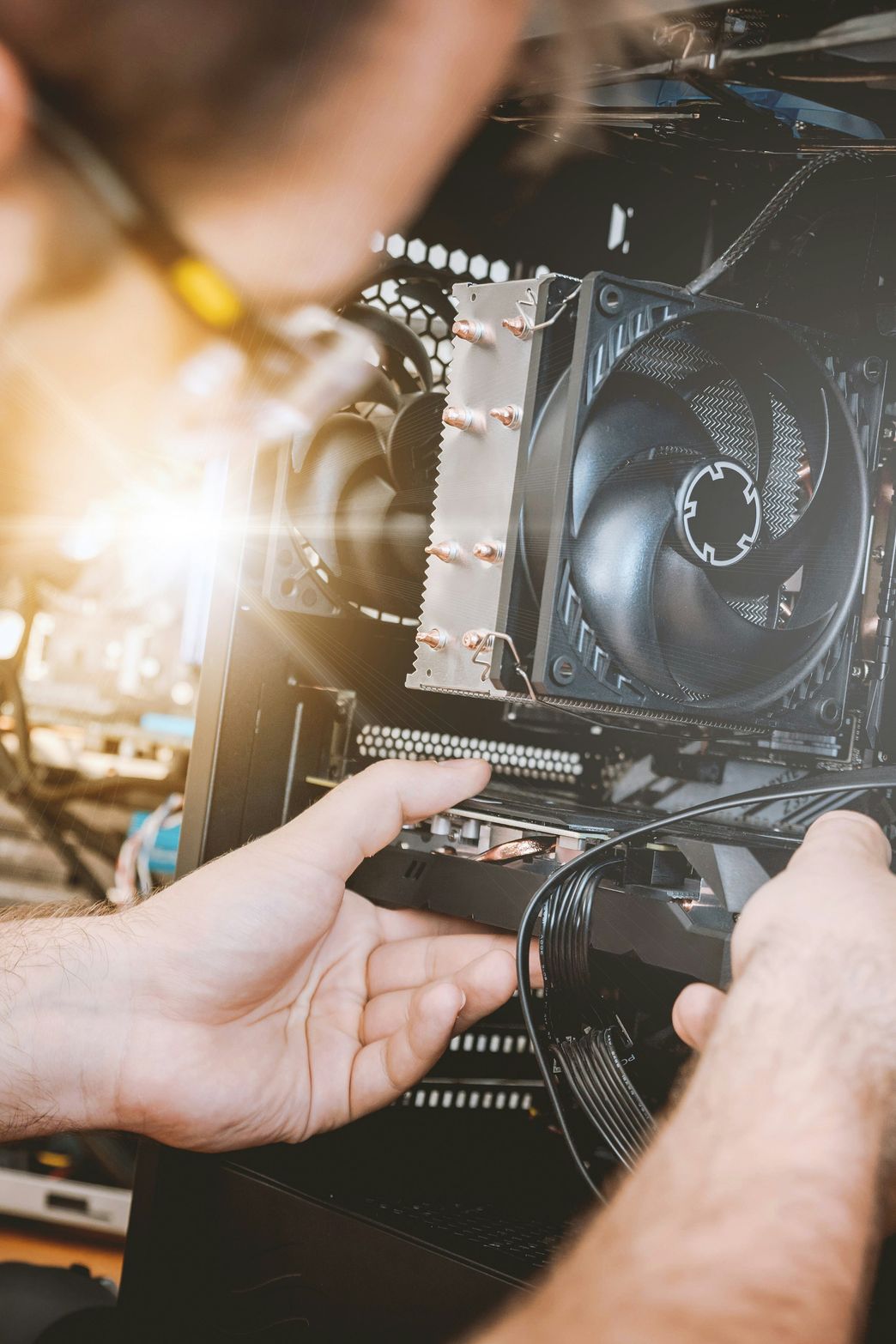 Technician repairing a desktop computer