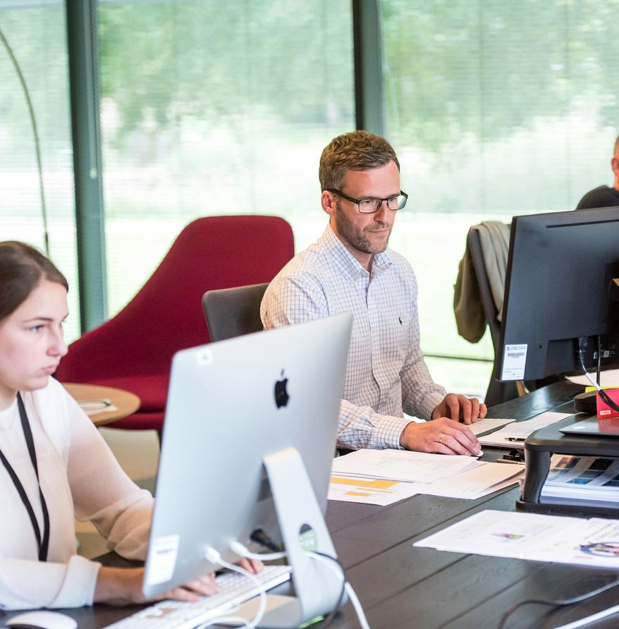 IT professionals working at computers in an office