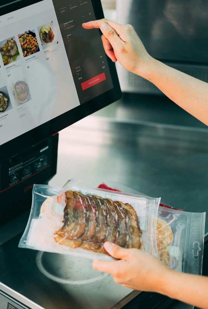 Business professionals reviewing technology hardware on a tablet