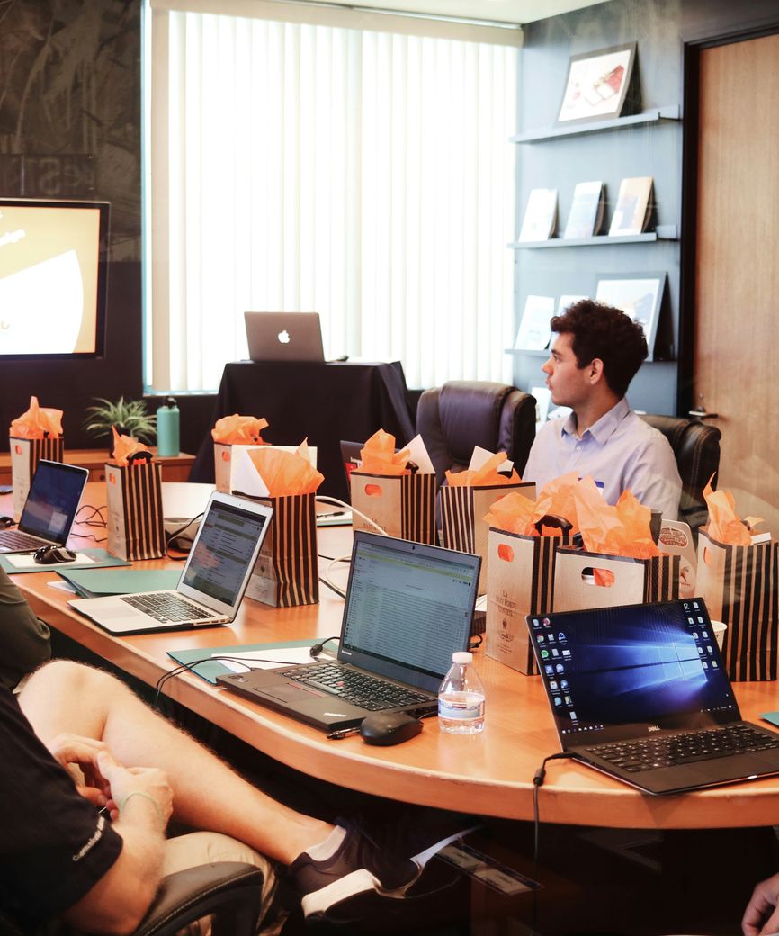 Employees receiving guidance on business technology
